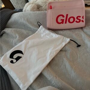Glossier Pink Pouch with Red Logo and White Bag